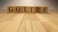 word goitre created from wooden letter cubes. Disease and health. close up. Royalty Free Stock Photo