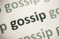 Word gossip printed on paper macro Royalty Free Stock Photo
