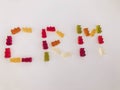 Word from gummy gummy bears. edible letters C, R, M. vitamin word. English alphabet. delicious appetizing dessert. bright bears on