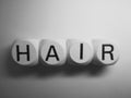 Word hair spelled on dice Royalty Free Stock Photo