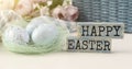 Word Happy Easter. The phrase is laid out in wooden letters. Top view. Motivation. Blue background. The minimum concept