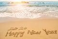 Write 2020 happy new year on beach