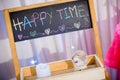 Word HAPPY TIME, hand writing on blackboard. chalkboard with colorful chalk. Royalty Free Stock Photo