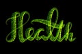 The word health is made of glowing green particles on a black background. Concept of healthcare and Selfisolation Royalty Free Stock Photo