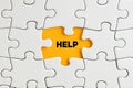 The word help on yellow missing puzzle piece. Support, assistance or guidance Royalty Free Stock Photo