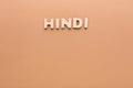 Word Hindi on beige background Royalty Free Stock Photo