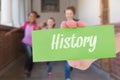 History against cute pupils running down the hall Royalty Free Stock Photo