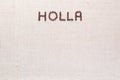 The word Holla written with coffee beans shot from above, aligned at the top Royalty Free Stock Photo