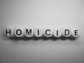 Word homicide on wooden dice Royalty Free Stock Photo