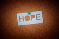 The word Hope pinned to a cork board Royalty Free Stock Photo