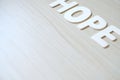 The word HOPE, wooden letters on a wooden table Royalty Free Stock Photo