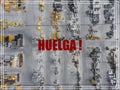 Word Huelga in spanish language. Industrial storage place, view