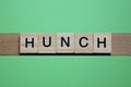 word hunch made of small gray wooden letters Royalty Free Stock Photo