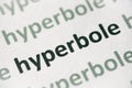 Word hyperbole printed on paper macro Royalty Free Stock Photo