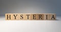 The word hysteria made of wooden cubes. . The term of interest in psychology