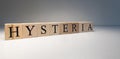 The word hysteria made of wooden cubes. . The term of interest in psychology