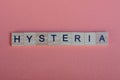 Word hysteria from small gray wooden letters