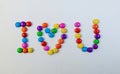 Word I LOVE YOU made of multicolored candies on white background Royalty Free Stock Photo