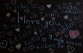 The word I love you is written in different languages and colors on the board. St. Valentina. The concept of love. Background