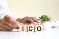 the word ICO, spelt on wooden cubes with letters over a white background ICO - short for Initial coin offering Royalty Free Stock Photo