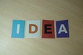 The word IDEA written on colorful note papers on board background. Idea concept Royalty Free Stock Photo