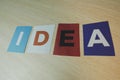 The word IDEA written on colorful note papers on board background. Idea concept Royalty Free Stock Photo