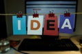 The word IDEA written on colorful note papers on board background. Idea concept Royalty Free Stock Photo