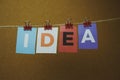 The word IDEA written on colorful note papers on board background. Idea concept Royalty Free Stock Photo
