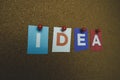 The word IDEA written on colorful note papers on board background. Idea concept Royalty Free Stock Photo