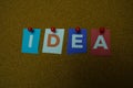 The word IDEA written on colorful note papers on board background. Idea concept Royalty Free Stock Photo