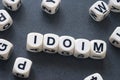 Word idiom on toy cubes Royalty Free Stock Photo