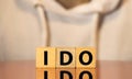 word IDO on wooden block, business concept