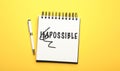 Word IMPOSSIBLE with crossed out letters IM written in notebook and pencil on yellow background, top view. Motivation and