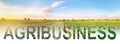 Word inscription agribusiness on agricultural plantation field. Crop and livestock growers. Agroindustry food industry. Production