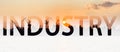 Word inscription industry on background of river port with ships at sunset. Logistics and infrastructure. Trade traffic. Industry