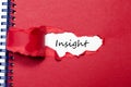 The word insight appearing behind torn paper Royalty Free Stock Photo