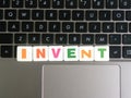 Word Invent on keyboard background Royalty Free Stock Photo