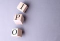 Word IPO on wooden block on the grey background Royalty Free Stock Photo