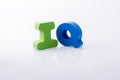 the word IQ written with letter blocks