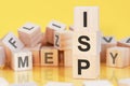 Word ISP from wooden blocks with letters, concept