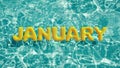 Word `JANUARY` shaped inflatable swim ring floating in a refreshing blue swimming pool