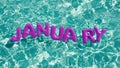 Word `JANUARY` shaped inflatable swim ring floating in a refreshing blue swimming pool