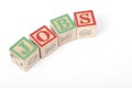 The word `JOBS` spelt out with Children`s building blocks