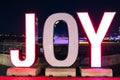 the word joy is lit up in red and white at night Royalty Free Stock Photo