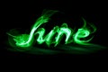 Word June on a black background smoke effect Royalty Free Stock Photo