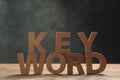 Word KEYWORD made of wooden letters on table