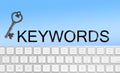 Word Keywords, computer keyboard and key on blue background. SEO direction Royalty Free Stock Photo
