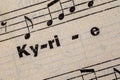 The word Kyrie on a page of an old prayer and hymn book Royalty Free Stock Photo