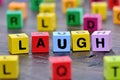 The word Laugh on table