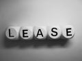 Word lease spelled on wooden dice Royalty Free Stock Photo